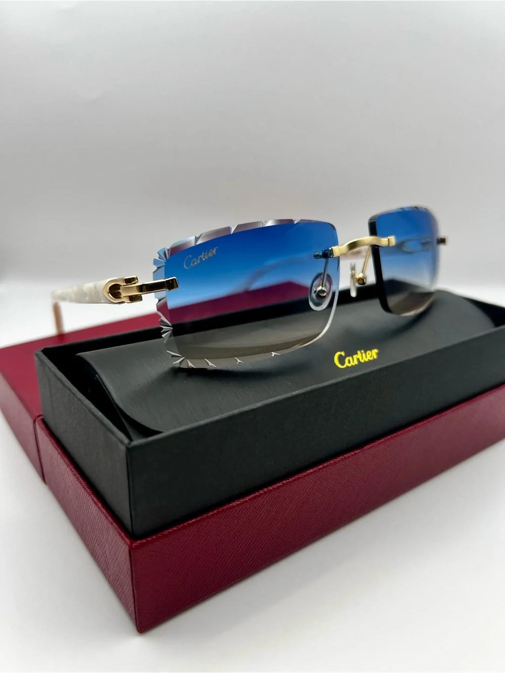 Cartier Blue Gradient Rimless Sunglasses with Gold and White Accents
